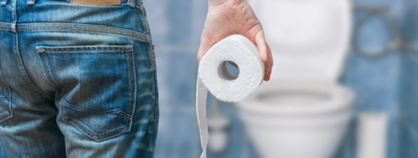 Man suffers from diarrhea holds toilet paper roll