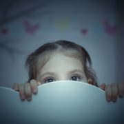 scared little girl in her bed